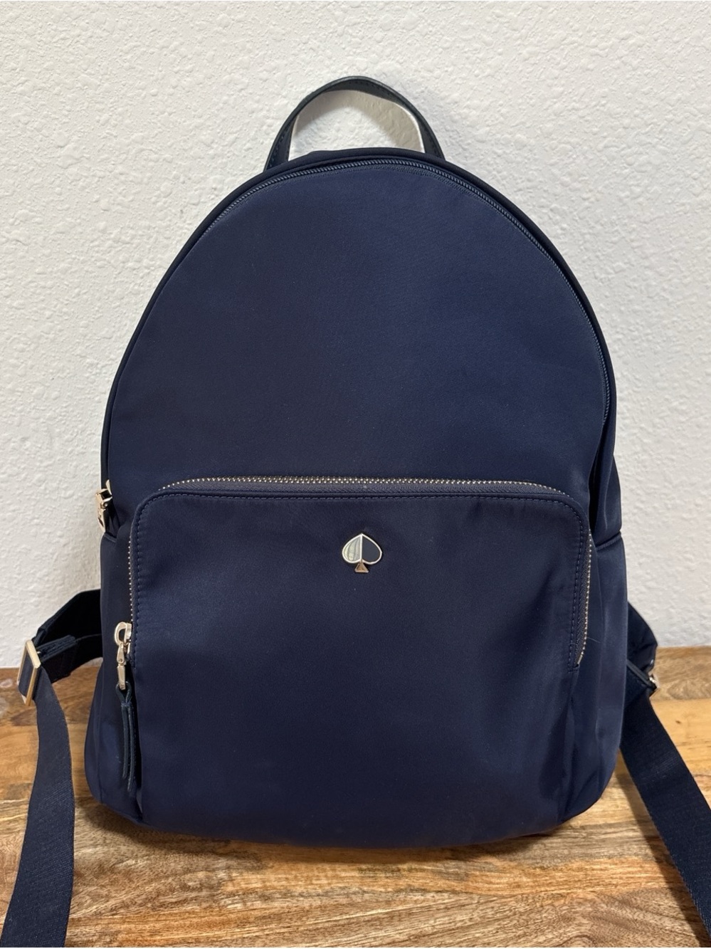 kate spade Taylor Backpack navy blue nylon backpack with gold-tone spade logo